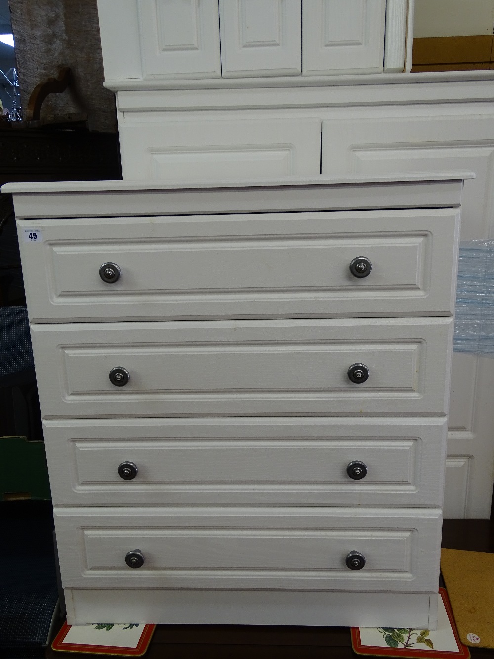 White quality modern bedroom suite comprising wardrobe, narrow chest and a four drawer chest