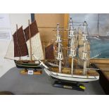 Three model sailing boats