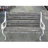 Wooden slatted garden bench with white cast metal ends