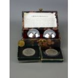 Cased set of Chinese iron balls and a small selection of commemorative coins etc