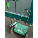 Manual power base cylinder mower and seed spreader box