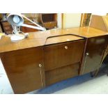 A mid-century Beautility cocktail cabinet sideboard, 140cms wide Condition reports provided on