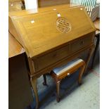 A mid-century imported hardwood sloped bureau with carved motif to the front and with stool, 91cms