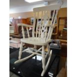 A painted white believed pine rocking chair Condition reports provided on request by email for