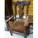 A good antique carved cushion seat elbow hall-chair Condition reports provided on request by email