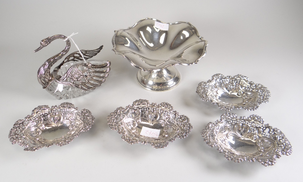 A silver tazza of lobed and ogee form raised over a circular foot, 4.9ozs together with a matching