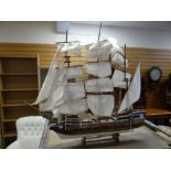 A twentieth century model sailing ship, 87cms wide Condition reports provided on request by email