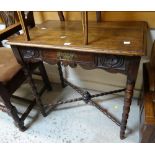 A neat carved antique oak low boy-type table with bobbin supports and single drawer, 75cms wide