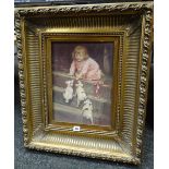 Gilt framed print of a young child with puppies, 39 x 29cms Condition reports provided on request by