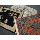 Two Chinese woollen rugs together with a believed silk patterned rug Condition reports provided on