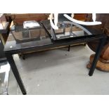 A contemporary black glass extending dining table Condition reports provided on request by email for