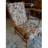 A Parker Knoll floral cushioned armchair Condition reports provided on request by email for this
