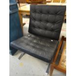 A retro buttoned black chair on chrome supports Condition reports provided on request by email for