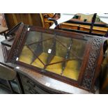 A nineteenth century mahogany narrow hanging corner cabinet with single glazed door and filigree-