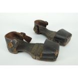 A pair of nineteenth century child's patten / overshoes having wooden hinging soles and leather heel