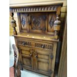 A good narrow linen-fold Reprodux Bevan Funnell court cupboard, 80cms wide Condition reports