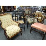 A parcel of chairs comprising a vintage mahogany elbow chair with floral tapestry cushion and back