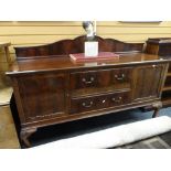 A good Edwardian mahogany railback sideboard of flanking cupboards and two centre drawers with