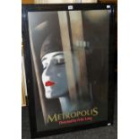 A framed reproduction cinema poster for the 1927 German classic film 'Metropolis', 102 x 71cms (