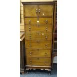 A good vintage narrow combination chest of six drawers and two-door cupboard having a dentil