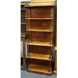 An unusual antique mahogany five-shelf whatnot with full length side cupboard and galleried top,