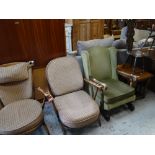 Two mid-century Ercol armchairs, a vintage wingback rocking chair, carved spinning chair & a nest of