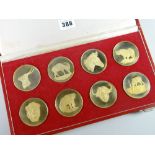 A 1975 cased set of eight gold plated silver medallions issued by The Wildlife Society of South