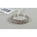 A seven-stone diamond half-hoop eternity ring with white metal setting Condition reports provided on