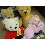 Five assorted teddy bears and a musical doll Condition reports provided on request by email for this