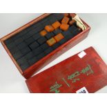 An early to mid-century Mahjong set in a hardwood box with sliding lid Condition reports provided on
