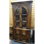 A good antique-reproduction standing corner cupboard with upper glazed section and based cupboard,