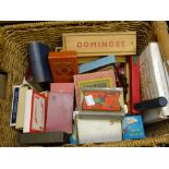 A modern basket containing mid-century and vintage playing card games, sets of domino's ETC
