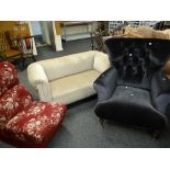 A modern wing back buttoned velvet covered armchair together with a vintage floral red chair and a
