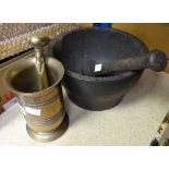 A large cast metal vintage pestle & mortar and a similar brass example Condition reports provided on