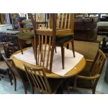 An oval G-Plan extending dining table and 4+2 matching chairs Condition reports provided on