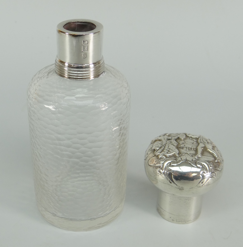 A textured glass dressing table bottle with silver screw lid and collar having repousse decoration - Image 3 of 3