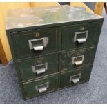 A vintage painted metal six-drawer filing chest with mounted white metal index holders and gilded