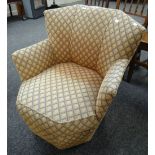 A vintage geometric patterned upholstery horseshoe shaped armchair Condition reports provided on