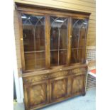 A good reproduction Bevan Funnell bookcase cupboard with glazed upper section, 150cms wide Condition