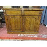 AN EARLY VICTORIAN MAHOGANY CHIFFONIER BASE having two drawers and two cupboards with inset