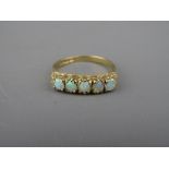 A NINE CARAT GOLD FIVE STONE OPAL DRESS RING, 2.2 grms gross, size 'O/P'