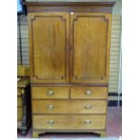 A MID 19th CENTURY MAHOGANY TWO PIECE PRESS CUPBOARD having a dentil cornice over two cupboards