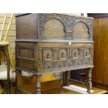A VINTAGE JACOBEAN STYLE OAK CHEST ON STAND, the rectangular top with beaded edging, iron lock and