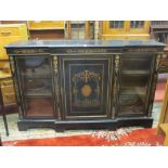 A LATE VICTORIAN EBONIZED BREAKFRONT & ORMOLU INLAID CREDENZA having a centre blind cupboard with