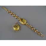 A FOURTEEN CARAT GOLD LINK BRACELET with large centre oblong citrine, 2 x 1.5 cms, 18.5 grms gross