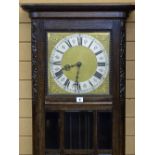 A 1930's OAK ENCASED TRIPLE WEIGHT LONGCASE CLOCK having a brass and silvered dial and with a nine