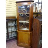 A REPRODUCTION MAHOGANY TWO PIECE CORNER CUPBOARD the upper section having a single astragal