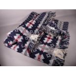 A TRADITIONAL WELSH WOOLLEN BLANKET in various blues and greys, 220 x 216 cms approximately
