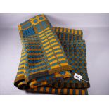 A TRADITIONAL WELSH WOOLLEN BLANKET in blue, black and mustard tones, 175 x 220 cms approximately (