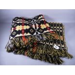 A TRADITIONAL WELSH WOOLLEN BLANKET in yellow, black and red tones, 215 x 152 cms approximately (